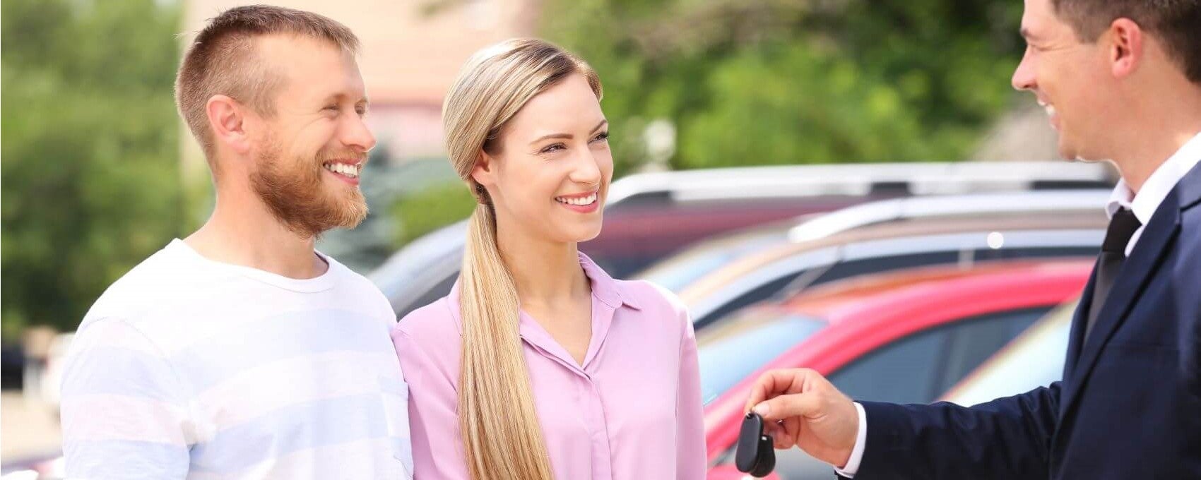 Couple Taking Keys from Dealer Snipped
