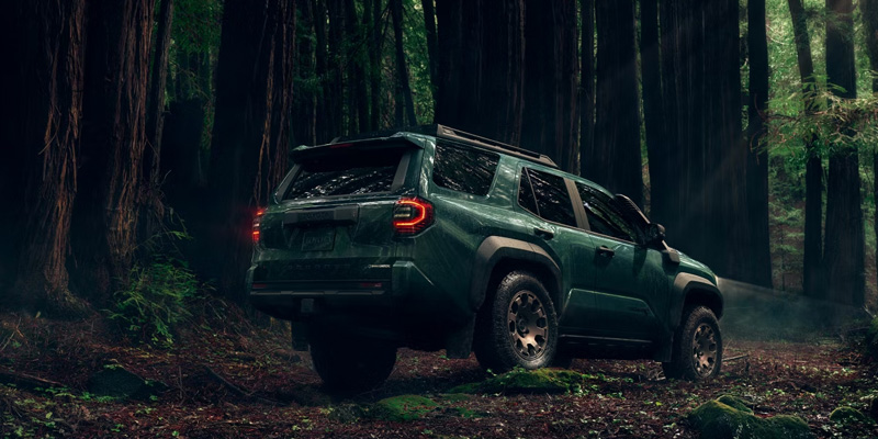 4Runner in green driving through the forest
