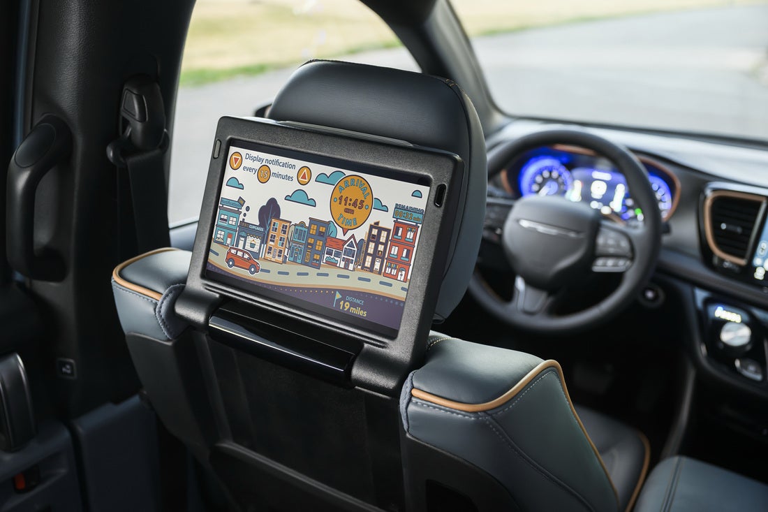 2027 Chrysler Pacifica available Theater Group 10.1-inch HD seatback touchscreen showing arrival time and remaining mileage