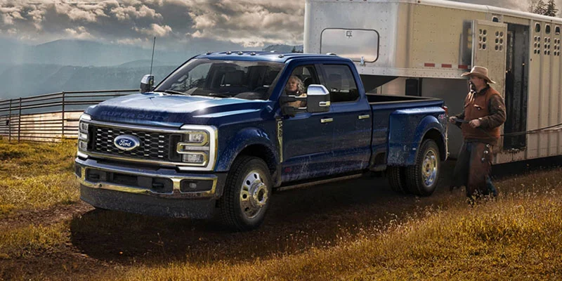 Ford Super Duty truck towing horse trailer on a ranch in Wyoming representing statewide vehicle transfers